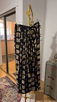 Black and tan geometric pattern skirt hanging full view
