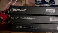 Stack of three Artika Maestro kit boxes showing brand and model