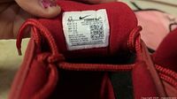 Size tag on tongue showing Nike branding and size 6.5W