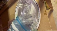 sealed clear plastic cutlery on plate