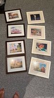 All eight framed prints laid out on floor