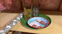 Group shot showing wrapping paper, both metal holders, plate and bowl