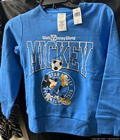 Front view of blue Disney Mickey Mouse sweatshirt with tags attached