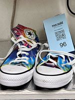 Front view of the pair showing toe caps, laces, and tie-dye pattern