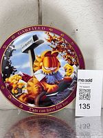 Front of Garfield decorative plate showing design and border text