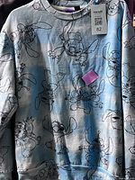 Full front view of blue Stitch graphic sweatshirt