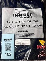 Front of sealed package showing In-N-Out Burger label and size XL