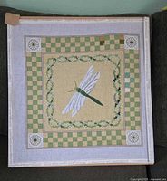 Full view of needlepoint canvas on frame