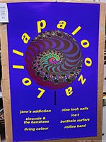 Full view of Lollapalooza poster showing artwork and band list