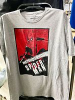 Front view of grey Spider-Man graphic T-shirt hanging