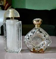 Front view of both Lalique perfume bottles