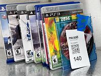 Front spines of eight PlayStation game cases showing titles and ratings