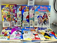 Front view showing 12 Archie digest comics standing and lying flat