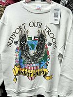 Front view of sweatshirt on hanger showing full graphic and overall condition