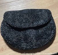 front view of black beaded purse closed