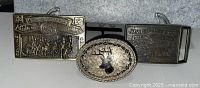 All three belt buckles front view