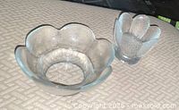 Large petal-rim clear glass bowl and small footed textured bowl