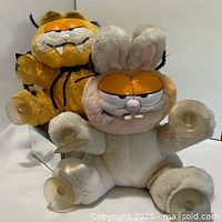 Both Garfield plush window clingers, Dracula and Bunny versions, showing suction cups
