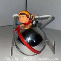 Front view of Hallmark Peeking Elf ornament on stand