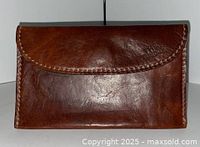Front view of brown leather clutch wallet