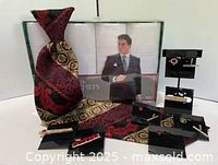 Tie, boxed handkerchiefs and tie clips displayed