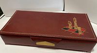 Exterior of brown leather Hickok valet case with chess graphic