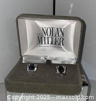 Earrings in open Nolan Miller box