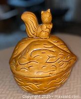 covered dish closed showing squirrel finial and walnut texture