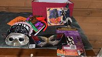 Lot overview of masks, headband, bag, garland, ornaments, packaged decorations and red box