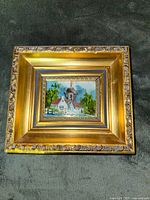 Front view showing framed oil painting