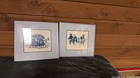 Both framed pictures side by side to show matching size and frames