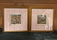 Front view of both framed needlepoints showing artwork, frames, mats