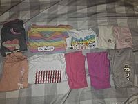All ten size 7–8 clothing items laid out