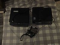 Brother and Samsung printers with Thermaltake power supply on checked surface