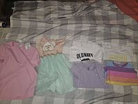 All six garments laid out showing colours, styles and prints