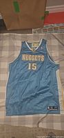 Front view of powder blue Carmelo Anthony #15 Denver Nuggets jersey