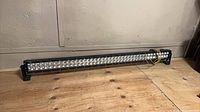 Full view of 40-inch LED light bar resting on floor