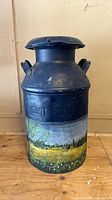 Full view of painted Mount Royal metal milk can