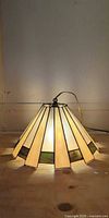 Illuminated stained glass lamp shade showing overall form