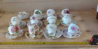 All teacup and saucer sets laid out for count and pattern view