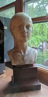 Front view of plaster bust on base
