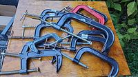 All nine C-clamps on tabletop