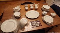 Entire Wedgwood California set laid out on table