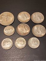 All nine 1967 Centennial coins laid out