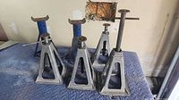 All six jack stands on padded surface