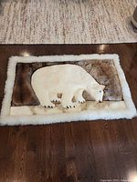 Full view of alpaca fur throw showing polar bear design and dimensions