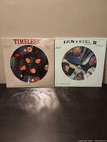 Front view of both sealed Timeless I and II picture disc LPs