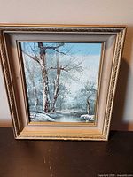 Full view of framed winter birch oil painting