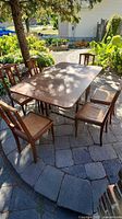 table and six chairs on patio