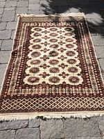 Full view of wool area rug laid flat showing overall pattern and size